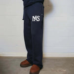 Natural Art Studio navy applique sweatpants with elastic waistband and relaxed oversized fit