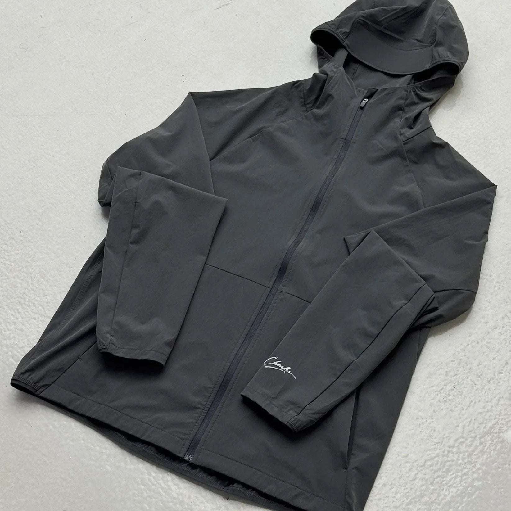 Studio By Charles Grey black track jacket with hood and zipper, lightweight and casual design