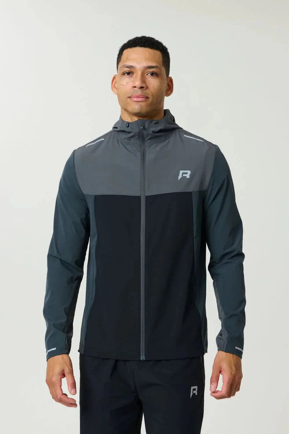 Reprimo Flight Windbreaker in slate and obsidian colors with zip pockets and lightweight weather protection