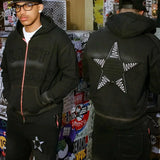 Last Lesson Appliqué Black Hoodie with star design and textured front in urban setting.