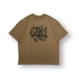 Baire Atelier brown puzzle graphic tee with high neckline and relaxed fit made from heavyweight cotton