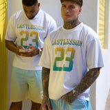 Men wearing Last Lesson gradient jerseys with number 23 in casual outdoor setting