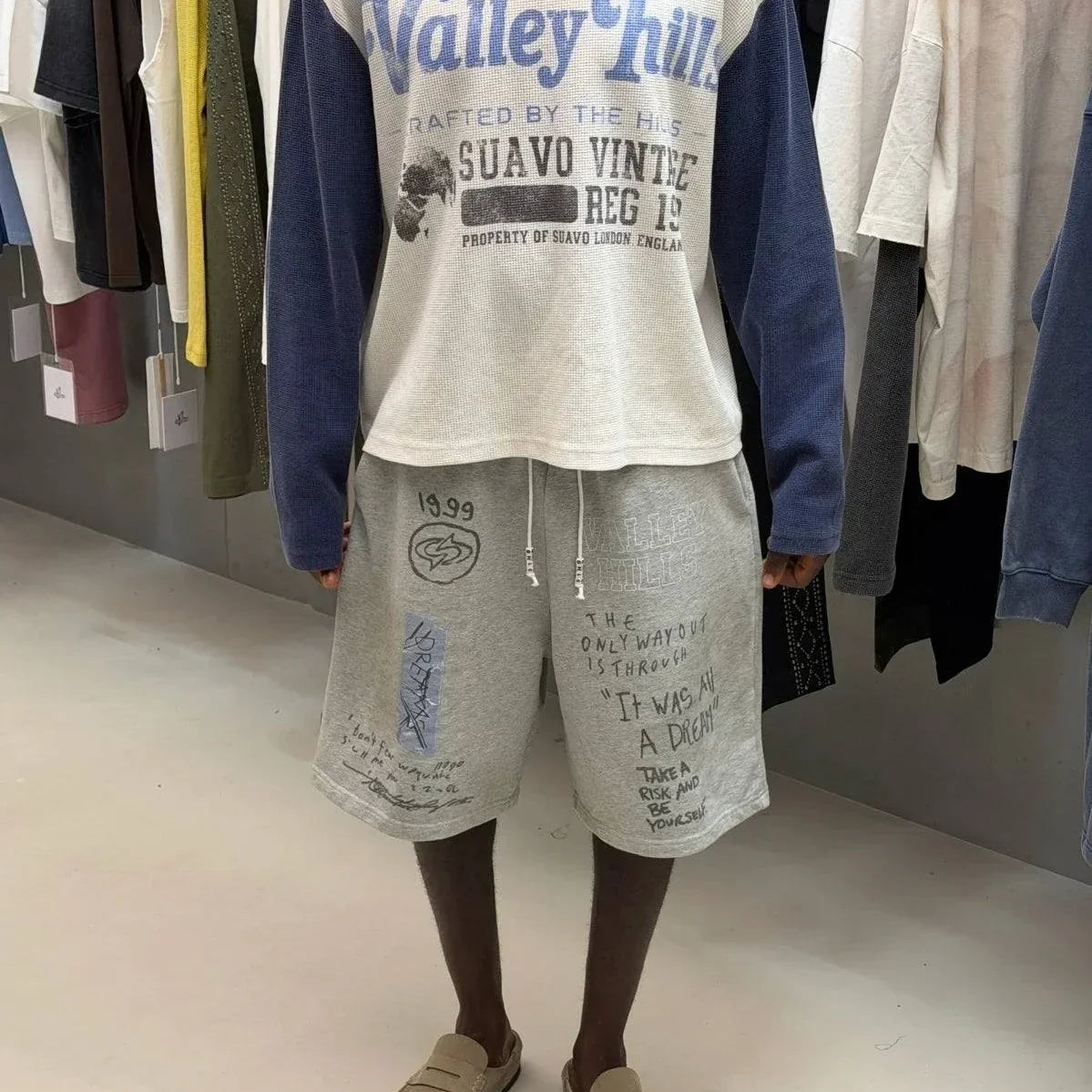 Washed grey Valley Hills shorts with punk-inspired graphics and vintage faded texture from Suavo London collection