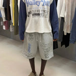 Washed grey Valley Hills shorts with punk-inspired graphics and vintage faded texture from Suavo London collection