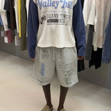 Washed grey Valley Hills shorts with punk-inspired graphics and vintage faded texture from Suavo London collection