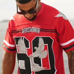 Man wearing red Last Lesson Eagle Jersey with eagle graphics and number 90 design