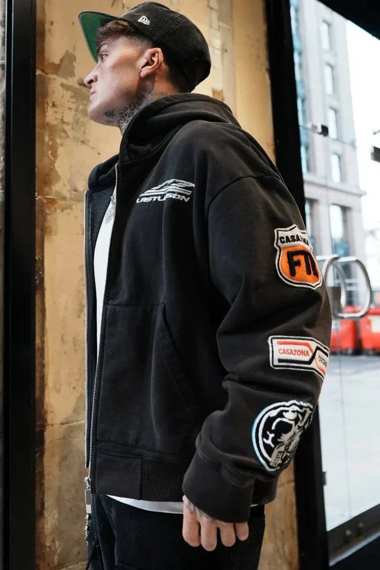 Black Last Lesson Badged Casazøna Hoodie with patches on sleeve worn by male model