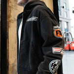 Black Last Lesson Badged Casazøna Hoodie with patches on sleeve worn by male model
