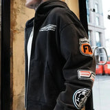 Black Last Lesson Badged Casazøna Hoodie with patches on sleeve worn by male model