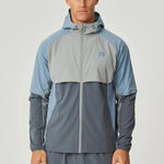 Reprimo Vortex Windbreaker in dusky blue with ergonomic design and reflective details, lightweight and wind-resistant jacket for active wear