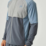 Reprimo Vortex Windbreaker in dusky blue with ergonomic panels and reflective details, lightweight and wind-resistant jacket.