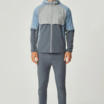Men's Reprimo Vortex Windbreaker in dusky blue with ergonomic fit and reflective details
