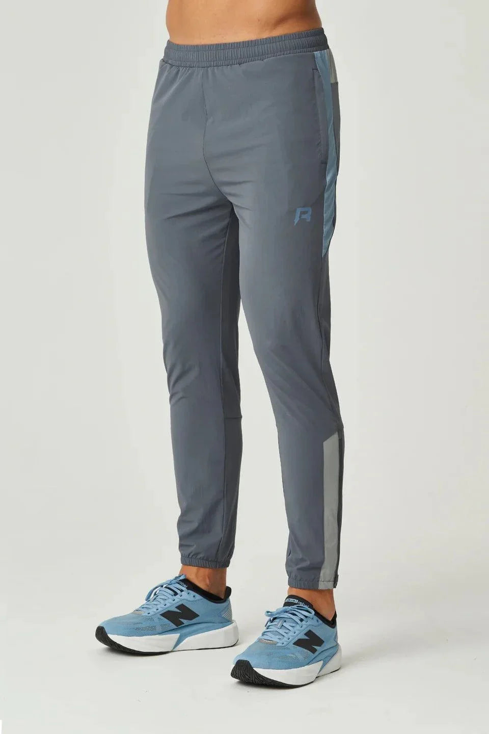 Reprimo Vortex Pants in dusky blue with ergonomic panels, adjustable waistband, and streamlined cuffs for flexible, performance-focused wear