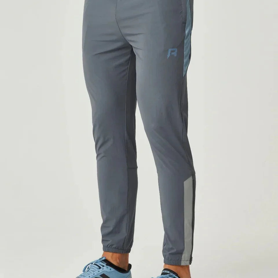 Reprimo Vortex Pants in dusky blue with ergonomic panels, adjustable waistband, and streamlined cuffs for flexible, performance-focused wear