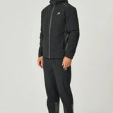 Man wearing black Reprimo Clima Jacket with zip pockets and hood, paired with matching pants