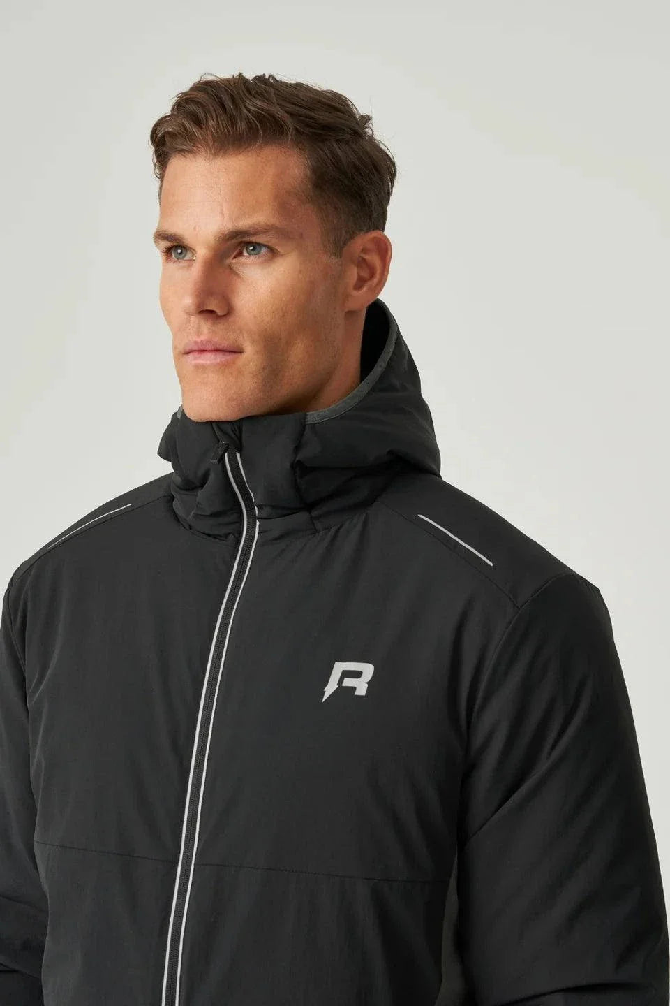 Man wearing black Reprimo Clima Jacket with hood and zippered front