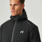 Man wearing black Reprimo Clima Jacket with hood and zippered front