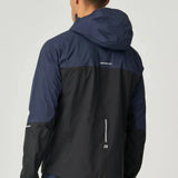 Back view of a man wearing a black and navy Reprimo Nova Jacket with hood and reflective details