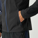 Close-up of Reprimo Nova Jacket in black and navy with zipper pocket and long sleeve detail