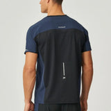 Back view of a man wearing a black and navy Reprimo Nova T-Shirt with reflective detailing and heat-sealed seams