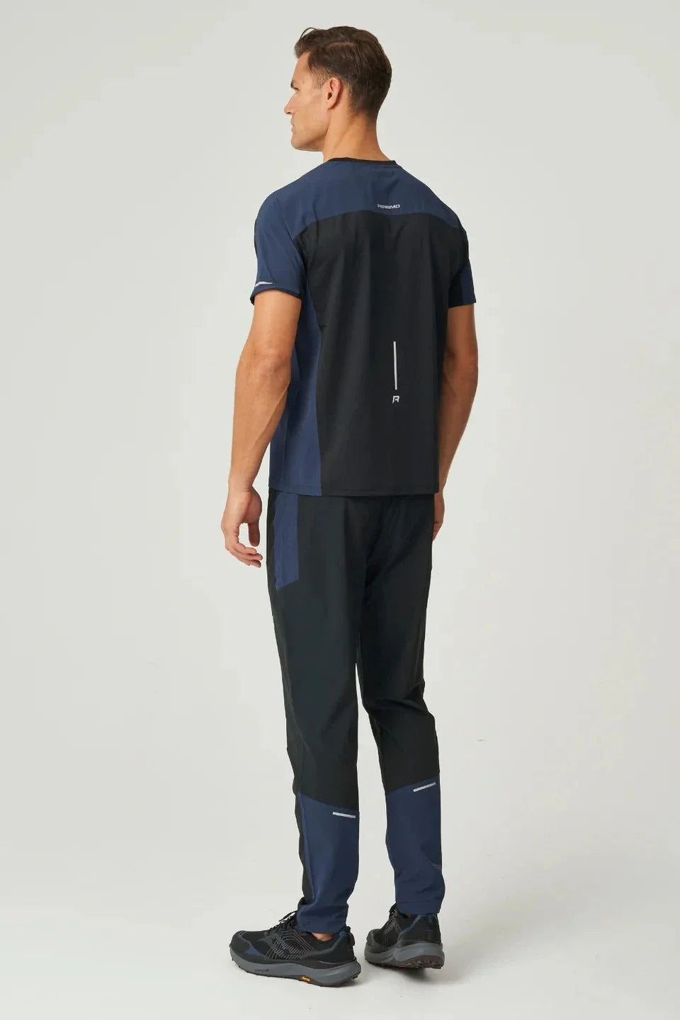 Men's Reprimo Nova T-Shirt in black and navy with duo-tone design, heat-sealed seams, and reflective details for athletic wear