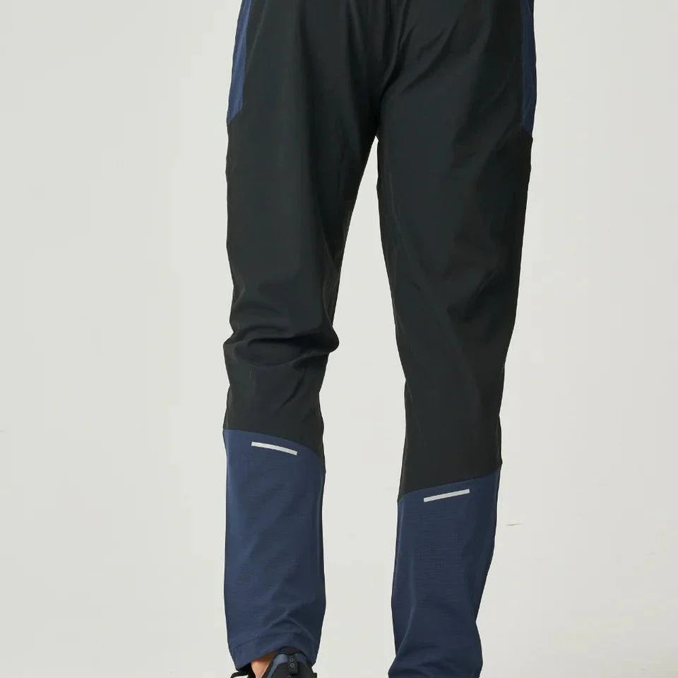 Back view of Reprimo Nova Pants in black and navy with ergonomic fit and adaptive waistband.