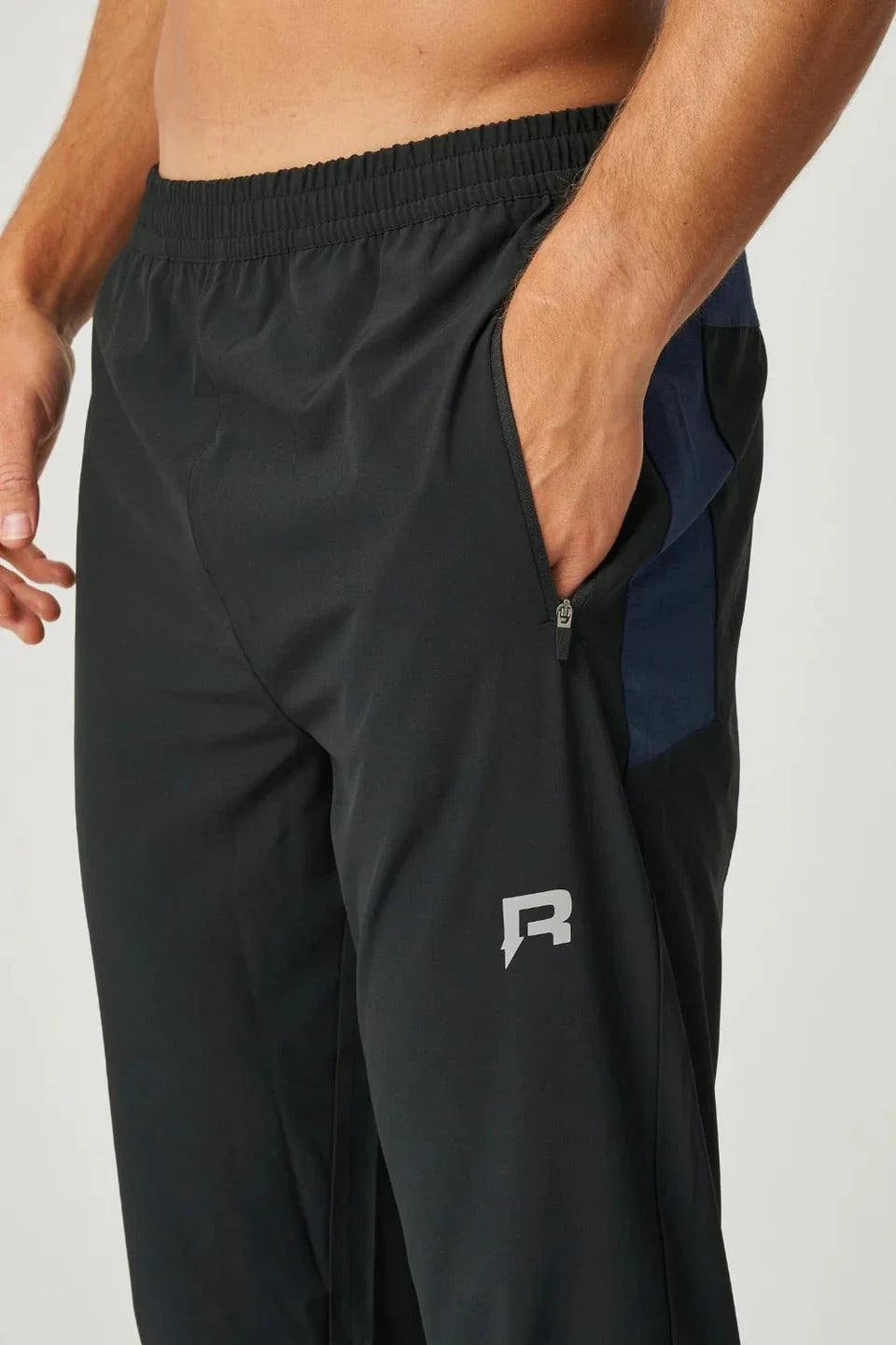 Reprimo Nova Pants in black and navy with lightweight dual-fabric design and ergonomic fit for active performance