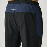 Back view of Reprimo Nova Pants in black and navy with elastic waistband and reflective logo detail