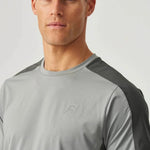 Male model wearing Reprimo Nova T-Shirt in slate and marble with duo-tone design, heat-sealed seams, and reflective detailing for athletic performance