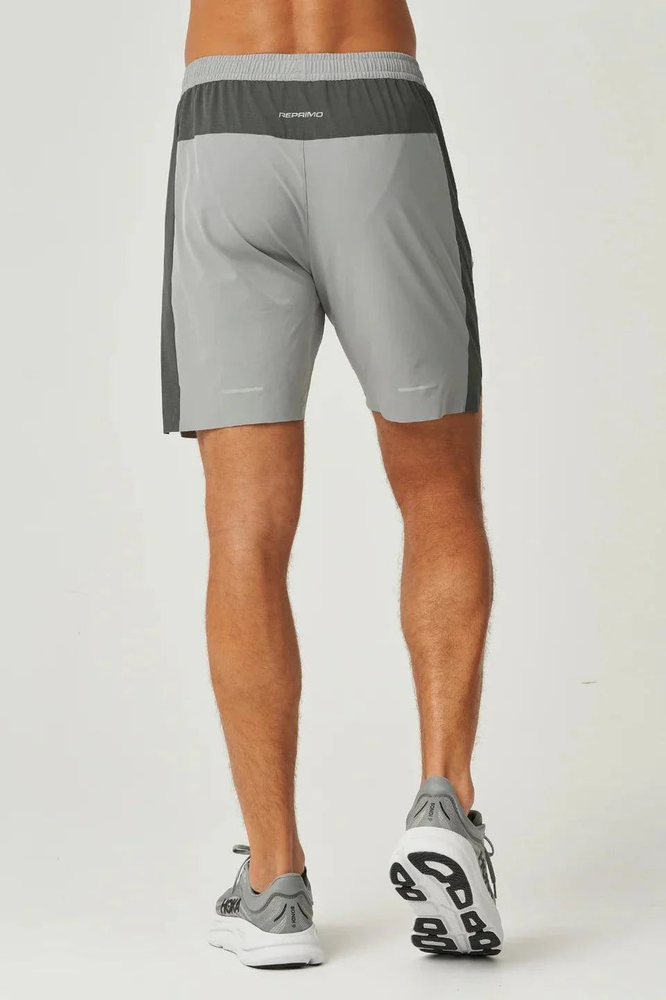 Back view of man wearing lightweight breathable Reprimo Nova Shorts in slate and marble colors for active performance