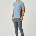 Man wearing dusky blue Reprimo Vortex T-Shirt with ergonomic panels and performance fabric