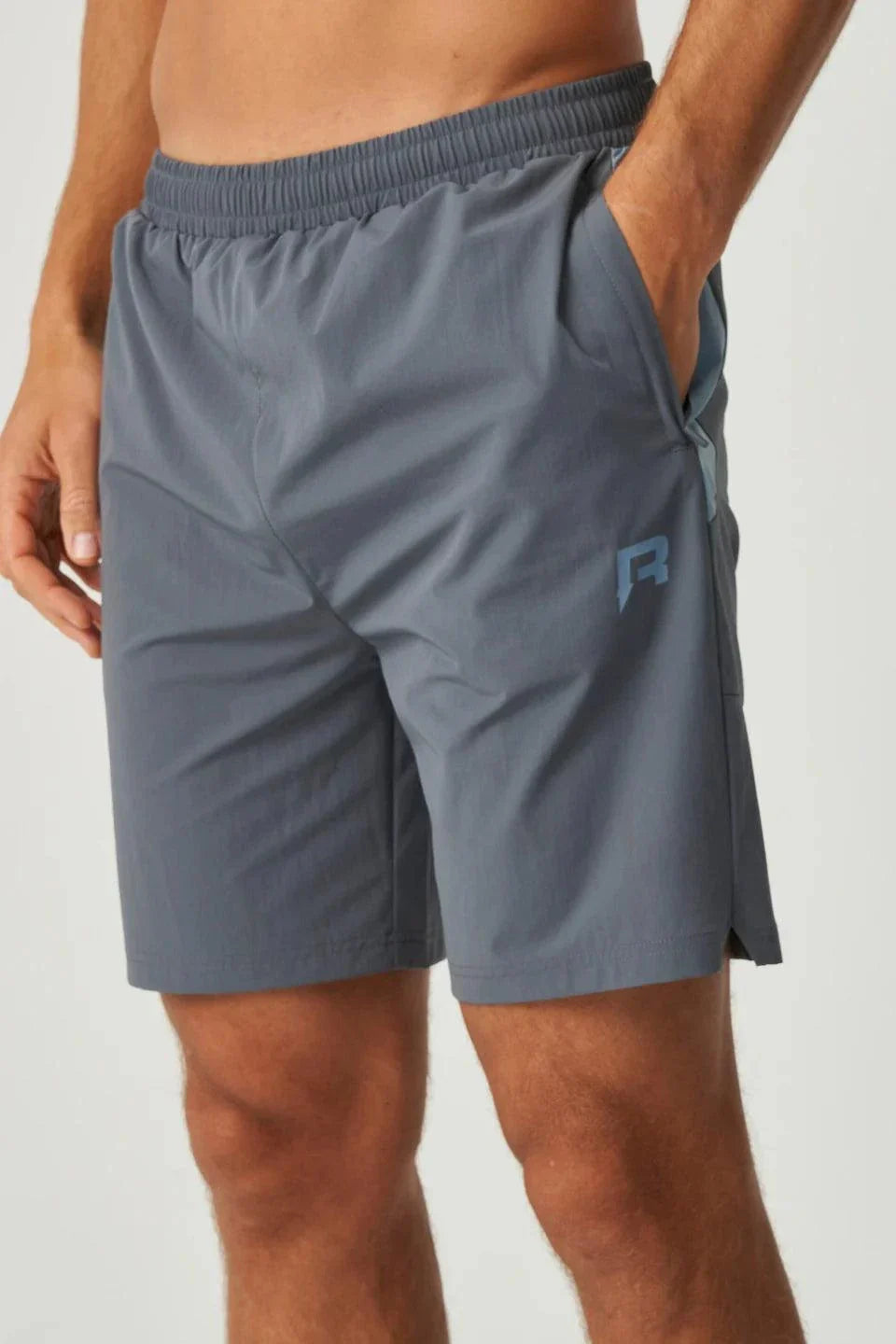 Men wearing dusky blue Reprimo Vortex Shorts with ergonomic panels and adjustable waistband