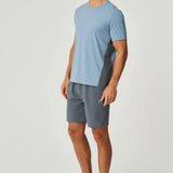 Man wearing dusky blue Reprimo Vortex Shorts with ergonomic panels and adjustable waistband.