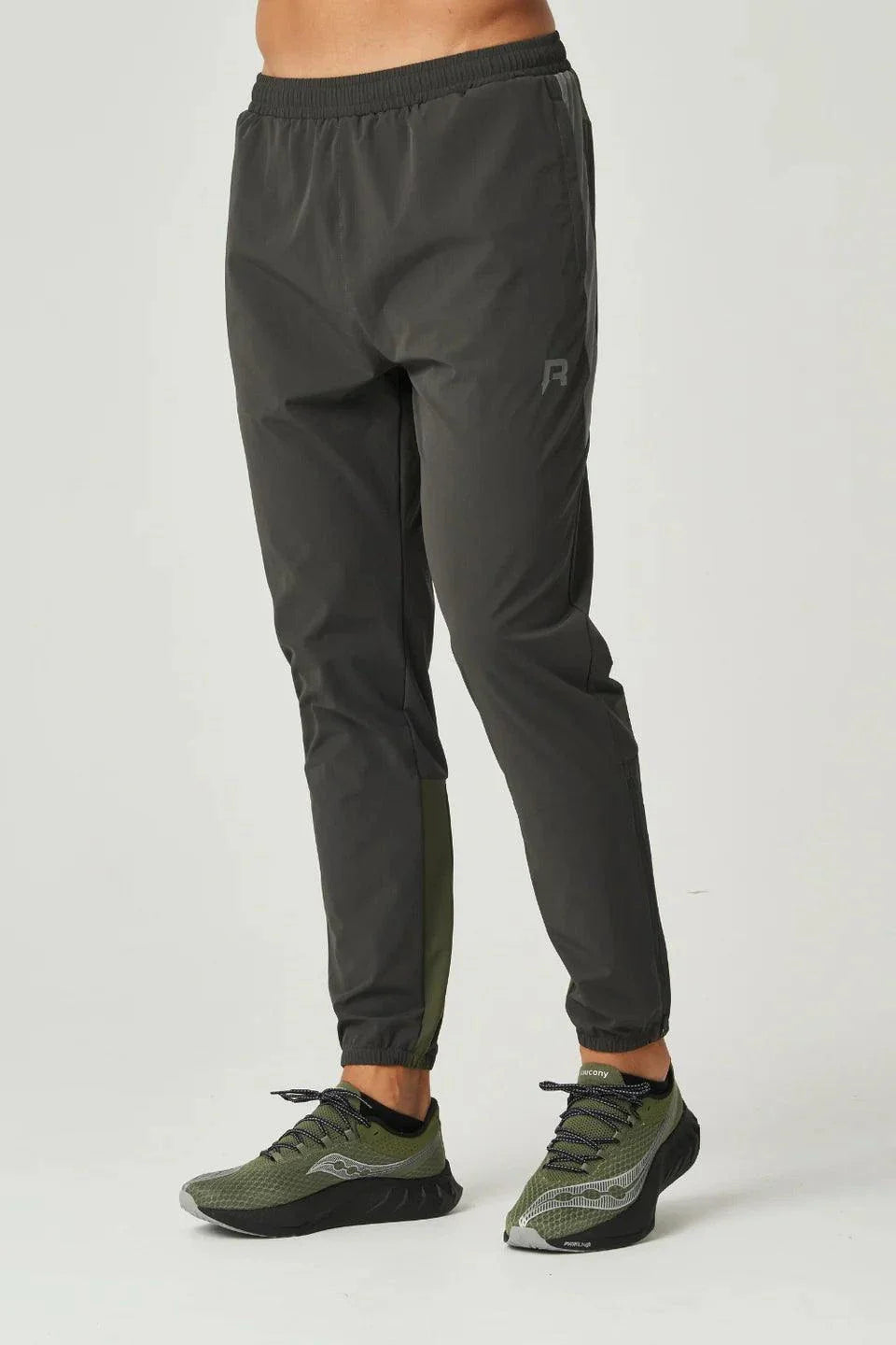 Reprimo Vortex Pants in olive and dark grey with ergonomic paneling and adjustable waistband for flexible performance
