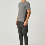 Man wearing Reprimo Vortex Pants in olive and dark grey with ergonomic and adjustable features.