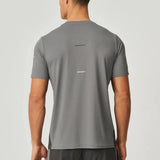 Back view of man wearing olive and dark grey Reprimo Vortex T-Shirt with ergonomic shaping and lightweight performance fabric