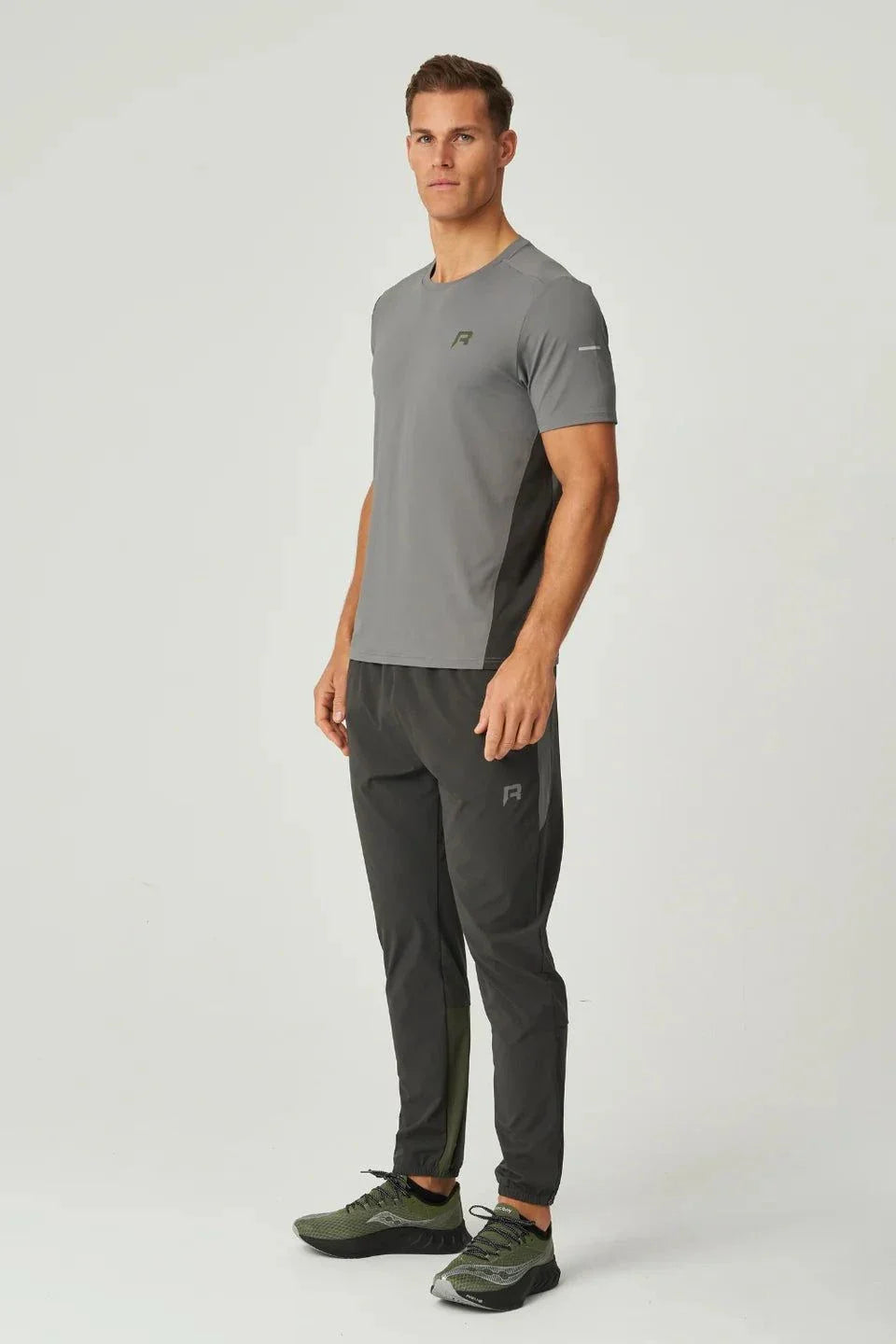 Reprimo Vortex T-Shirt in olive and dark grey with ergonomic fit and lightweight performance fabric worn by male model