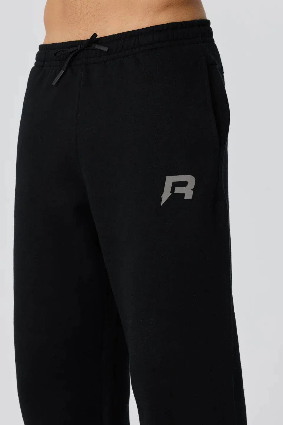 Black Reprimo Collective Joggers with adjustable waistband and reflective logo on brushed-back jersey fabric
