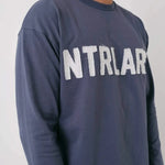 Natural Art Studio navy long sleeve cotton shirt with distressed appliqué front logo and screen print back logo