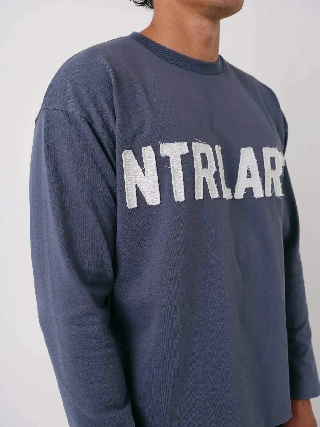 Natural Art Studio navy long sleeve cotton shirt with distressed appliqué front logo and screen print back logo