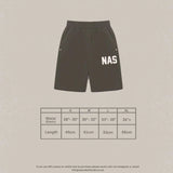 Natural Art Studio NAS appliqué black cotton shorts with elastic waistband and metal rivet pockets