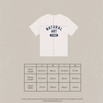 White Natural Art Studio Varsity Tee with navy screen print logo, boxy fit, oversized drop shoulder, made of 100% cotton, 350 GSM.