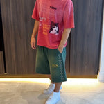 Green Suavo World studded sweat shorts with rhinestone diamond detailing and orange logo