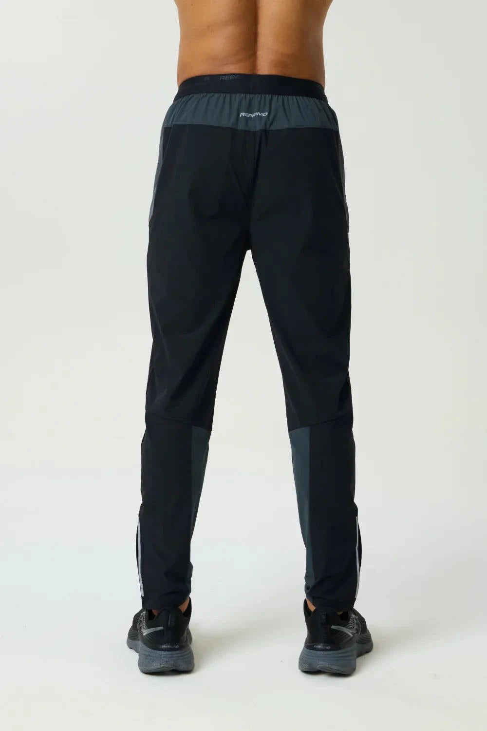 Reprimo Flight Pant Slate Obsidian with functional pockets, reflective strips, and breathable fabric for athletic performance