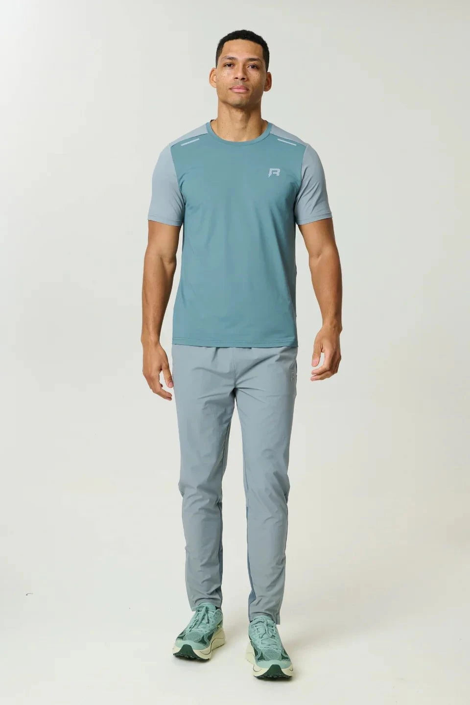 Reprimo Flight Pant Tide Marble with functional pockets and reflective strips for athletic performance and comfort