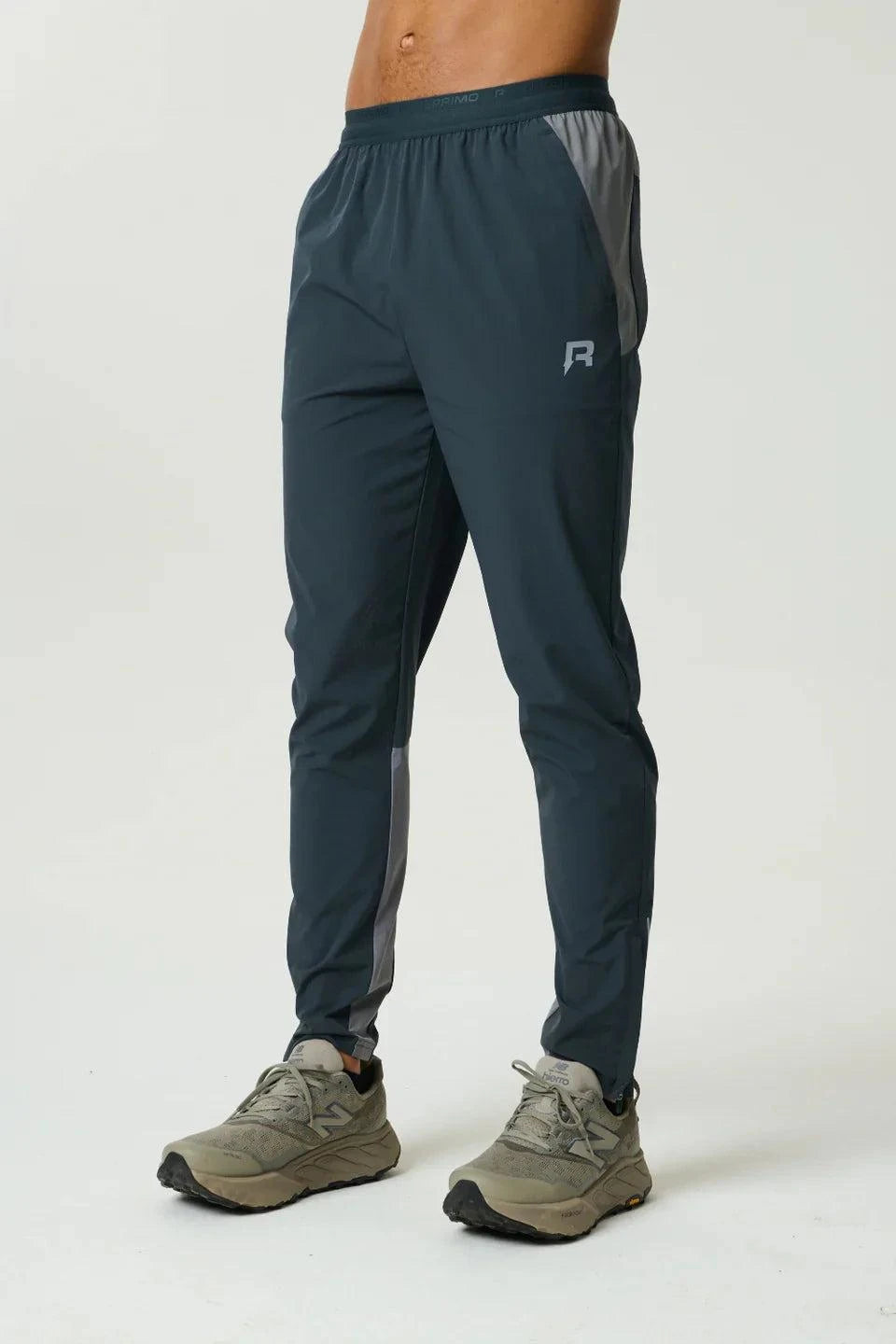 Reprimo Flight Pant in Gargoyle Ash Green with functional pockets, reflective strips, and breathable fabric for athletic performance