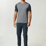 Reprimo Flight Pant in ash green with functional pockets and reflective strips for athletic performance and comfort