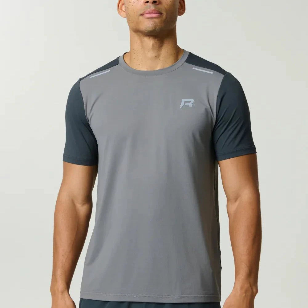 Reprimo Flight T-Shirt in ash green with lightweight, breathable fabric and reflective strips for athletic performance and visibility