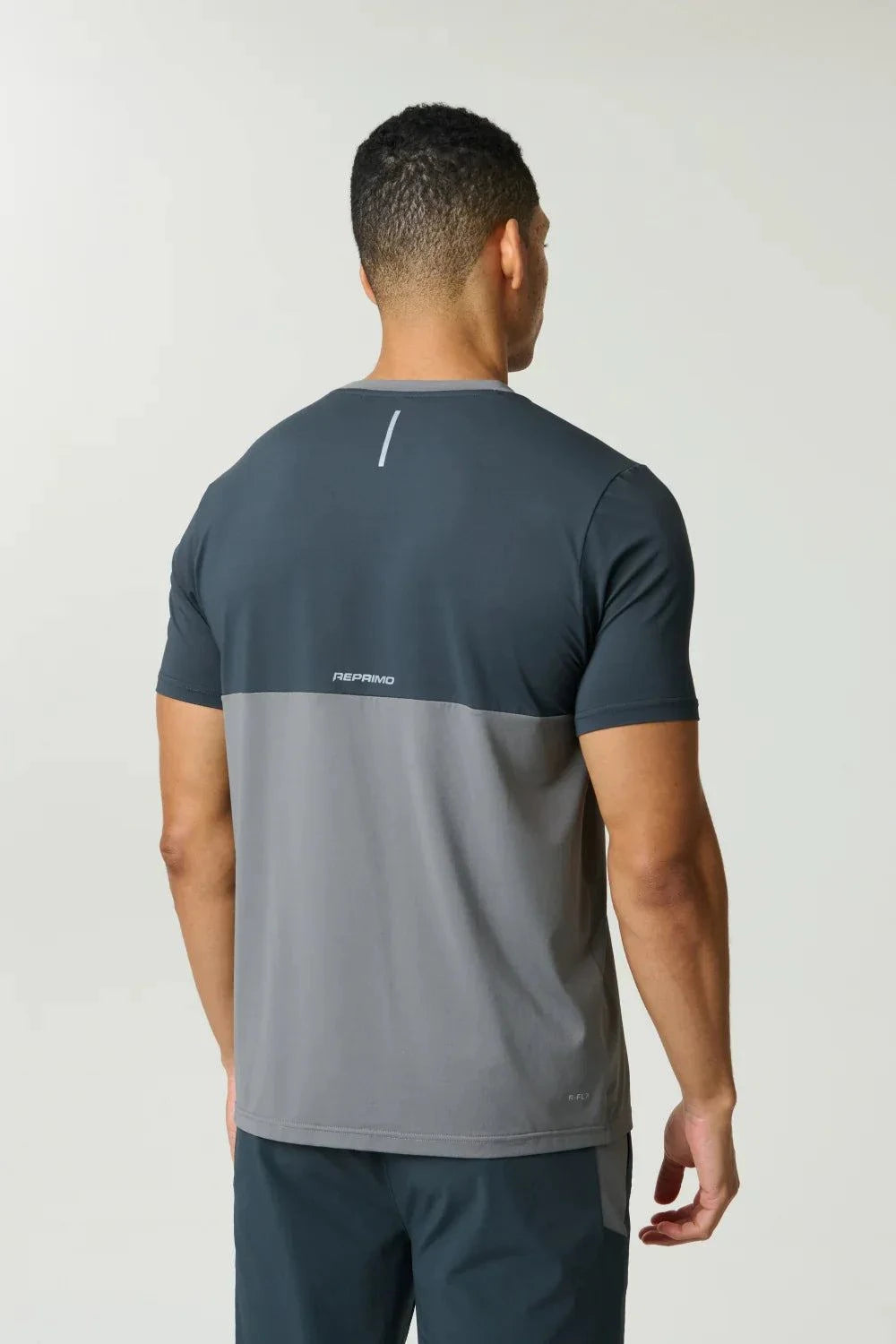 Reprimo Flight T-Shirt in Ash Green with athletic fit, lightweight fabric, two-color block design, and reflective strips for visibility