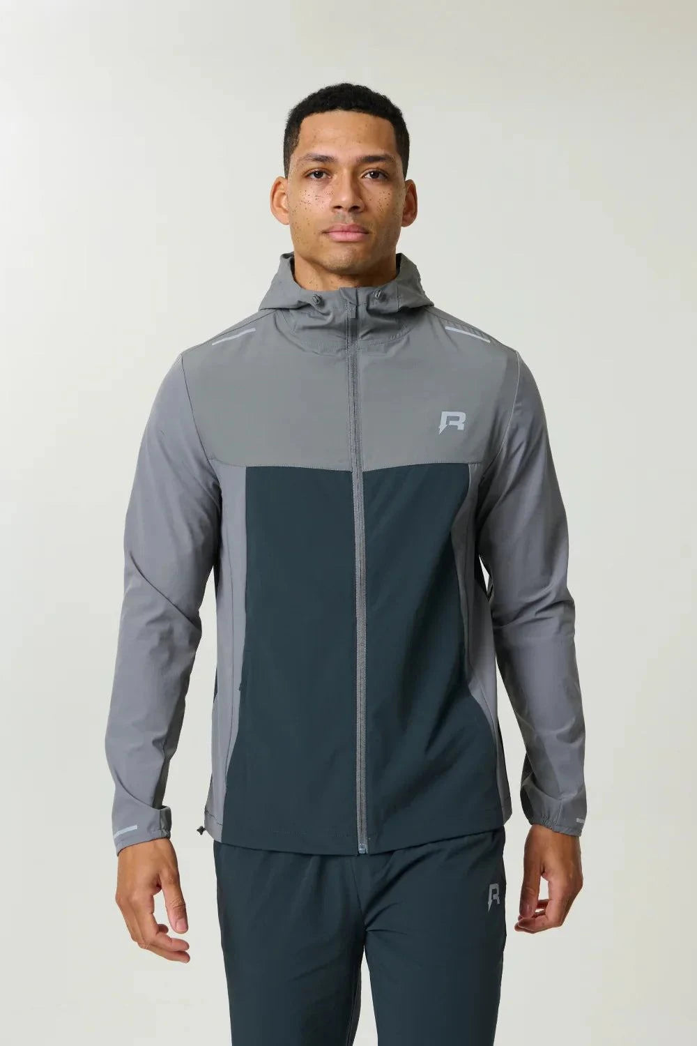 Reprimo Flight Windbreaker in Gargoyle Ash Green lightweight weather-resistant jacket with zip pockets and back vent for outdoor activities